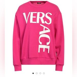 Versace pink sweater.
